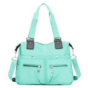 (Compre 1 Leve 2) Bolsa Feminina Impermeável Myla + Brinde Exclusivo!